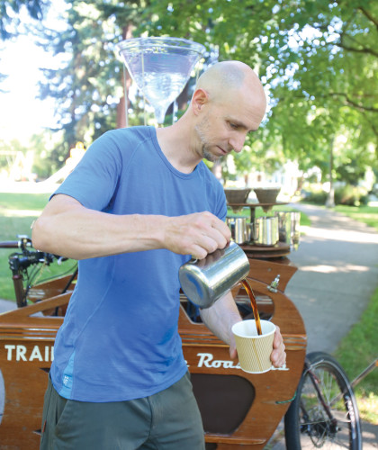 Above, Charlie Wicker at his Trailhead Coffee Roaster's bike. (Photo: Cory Eldridge.) At top, one of Bean About Town's van's in London. (Photo: Laurette Wilkie.)